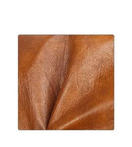 Macro shot of high quality brown lychee grain texture on a soft vintage tote bag