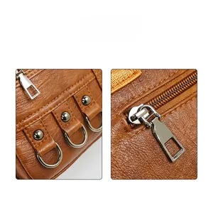 Macro shot of brown pebble grain leather texture with premium metal hardware and stitching
