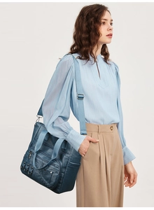 Detail of Morandi blue large tote bag with multiple pockets and nylon straps