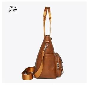 Side view of retro brown shoulder bag showing multiple zipper pockets and wide nylon strap