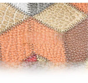 Close-up of golden metal logo on high-quality multi-color snakeskin leather tote bag