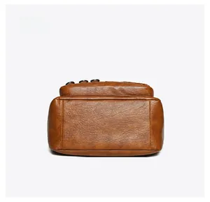 Macro detail of the flat base on this vintage brown leather tote bag with stitch decor