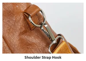 Detail of shoulder strap hook on brown lychee leather bag with silver metal buckle