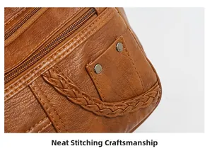 Detailed close-up of brown leather tote bag with precise stitching and metal hardware