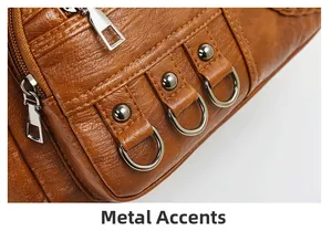 Detail of brown lychee grain leather bag with silver D-rings, rivets and zipper
