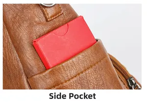 Detail of side pocket on brown vintage leather tote bag with precise yellow stitching
