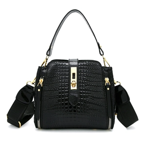 Elegant black faux crocodile pattern handbag with gold hardware and wide shoulder strap
