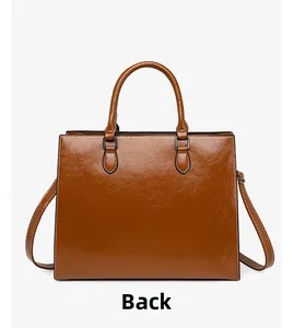 Detailed back view of a glossy caramel wax leather handbag with contrast stitching details