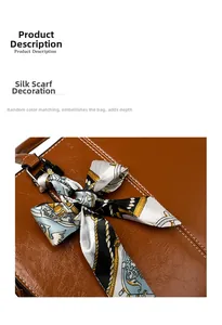 Close-up of brown textured leather bag handle adorned with a stylish printed silk scarf
