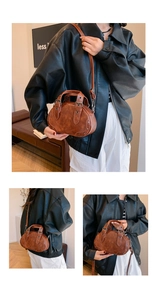Detail view of vintage brown PU leather bowling bag with studs and adjustable straps