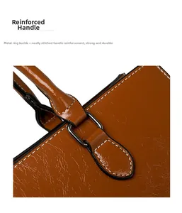 Detail of the caramel oil wax leather bag featuring white contrast stitching and silver hardware
