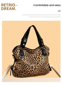 Detail view of leopard print tote bag with black leather handles and silver metal rivets