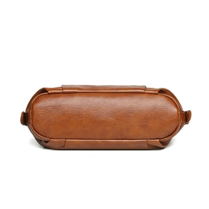 Bottom view of brown PU leather tote bag with smooth texture and neat stitching