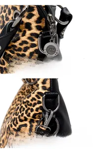 Detail of leopard print tote with branded metal zipper pull and detachable hook clasp