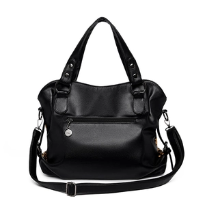 Large black textured leather tote bag with leopard print side panels and crossbody strap