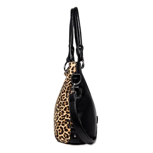 Fashionable leopard print tote bag for women featuring black leather stitching and top handles