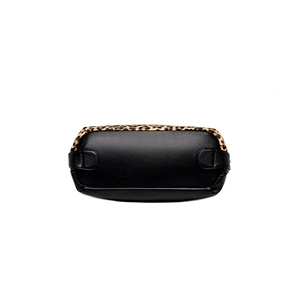 Bottom view of large black pebble leather tote bag with stylish leopard print details