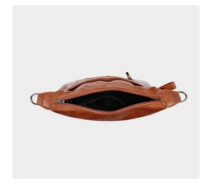 Close-up of the interior layout and brown leather texture of this stylish shoulder bag