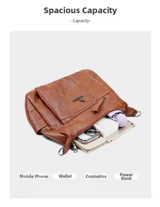 Crossbody bag capacity view showing space for tablet, umbrella, and daily items
