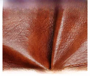 Macro shot of high-quality brown lychee pattern leather material with detailed texture