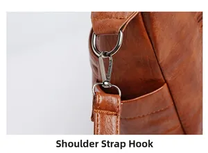 Detailed close-up of brown leather bag with silver metal D-ring and shoulder strap hook