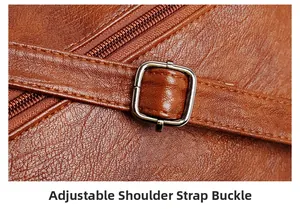 Macro detail of brown leather texture with adjustable silver metal shoulder strap buckle