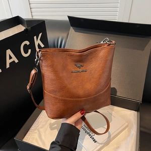 Elegant brown lychee pattern leather crossbody bag featuring a kangaroo metal logo
