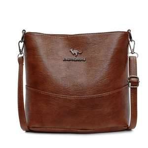 Brown minimalist bucket bag for women with adjustable leather strap and metal logo