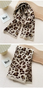 Detail of soft leopard print knitted scarf showing ribbed edges and plush texture