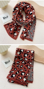 Detail of rust red leopard print knitted scarf with double-sided jacquard and ribbed edges