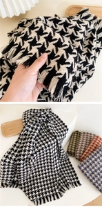 Detailed view of houndstooth scarf showing soft knit texture and fringe edge details