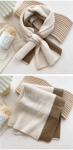Close-up of thick ribbed knit scarf in cream and brown with detailed texture view