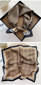 Detail of silk square scarf featuring classic houndstooth and plaid prints in gift box
