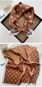 Detail of silk square scarf with white polka dots on caramel base and contrast borders
