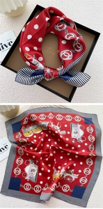 Detail view of red mulberry silk scarf with vintage nautical stripes and horse pattern