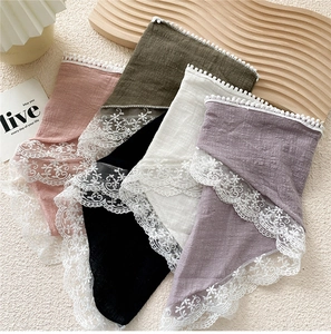 Close-up of five colorful cotton linen scarves with elegant wide embroidered lace edges