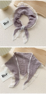 Detailed close-up of purple cotton linen scarf with elegant white lace trim and pompom edges