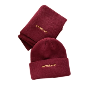 Burgundy knitted beanie and scarf set with yellow embroidery on soft ribbed fabric