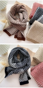Detail showing the thick knitted herringbone pattern and ribbed edges of the winter scarf