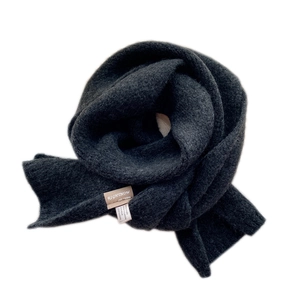 Solid charcoal grey knitted wool scarf for winter, soft ribbed texture in a spiral display