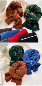 Close-up of colorful striped knit scarves showing soft texture and cozy winter styles