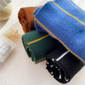 Striped knit scarves for women in blue, green, caramel, and black for winter warmth