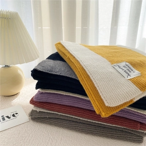Thick knit striped winter scarf for women in multiple colors with woven brand tag