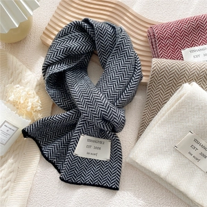 Winter herringbone knit scarves in black, burgundy, camel, and beige with patch label