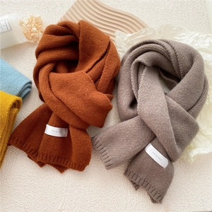 Thick solid knit scarf in caramel orange and grey purple with casual winter aesthetic
