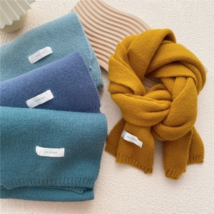 Thick knitted winter scarf in assorted solid colors with stylish ribbed edge finish