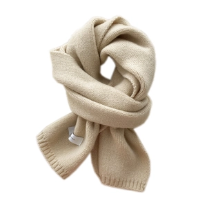 Thick beige chunky knit winter scarf for women in a stylish floating knot display style