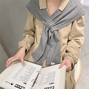 Chic grey knitted shoulder wrap scarf paired with a beige long sleeve dress for winter