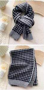 Close-up of heart pattern jacquard knit scarf with gray and black textured finish