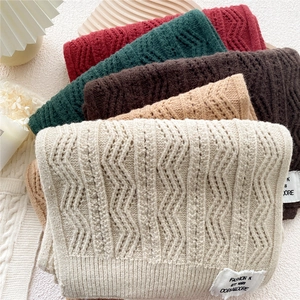 Thick knit winter scarves in five colors featuring hollow wave patterns and soft texture
